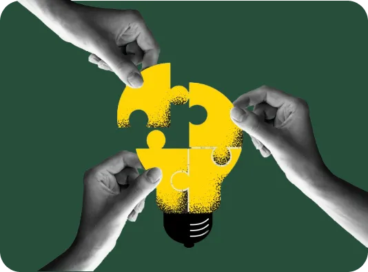 Hands assembling lightbulb puzzle